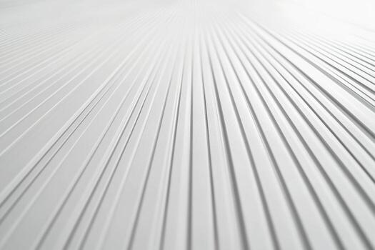 Textured white surface with parallel lines creating depth photo
