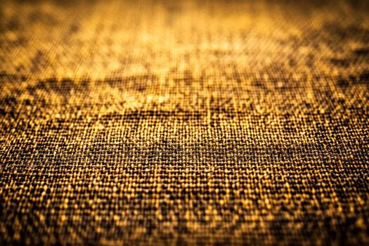 Textured fabric surface glistening under soft lighting photo