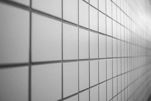 White tiled wall pattern with subtle reflections and shadows photo