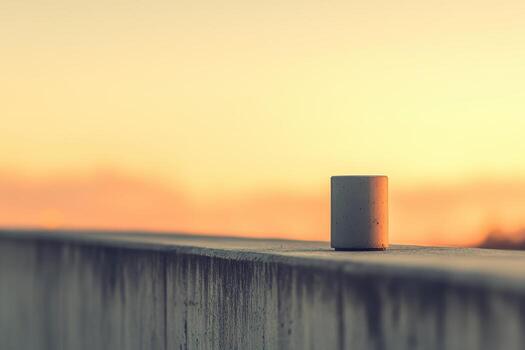 View of a small concrete cylinder at sunset photo