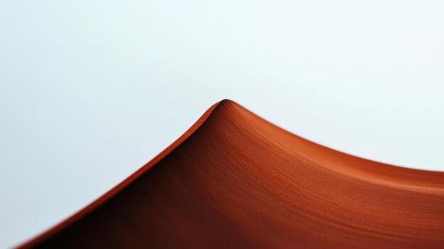 Curved brown surface creating subtle wave patterns photo
