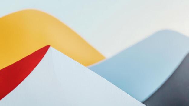 Colorful abstract shapes forming smooth waves on a surface photo