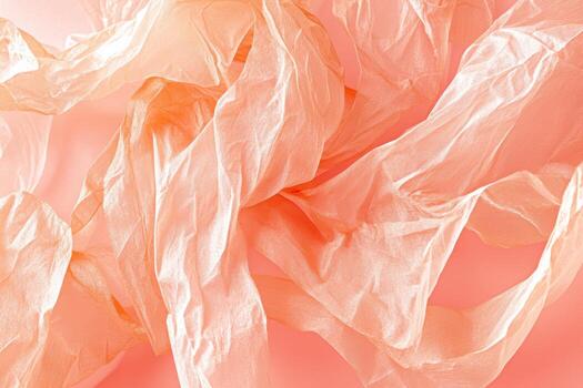 Delicate peach-colored fabric in soft waves and folds photo