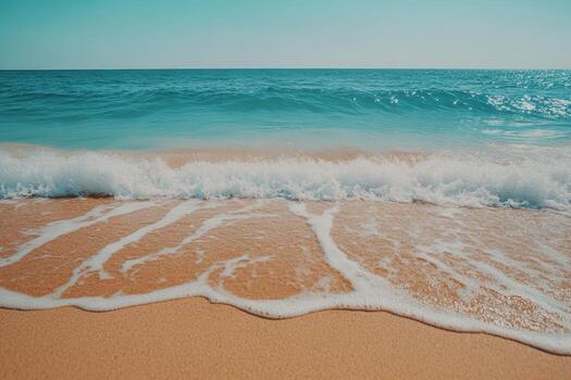 Waves gently lapping on a sunny beach shore photo