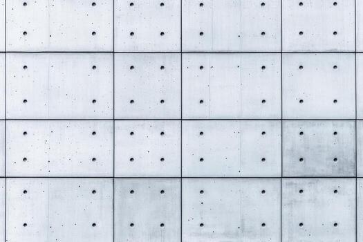Concrete wall with evenly spaced texture and design elements photo