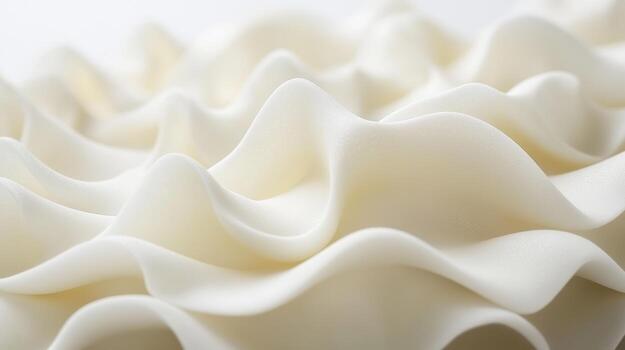Soft white fabric displays gently flowing waves and folds photo