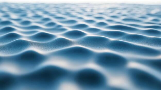 Rippling blue waves create a tranquil surface in sunlight photo
