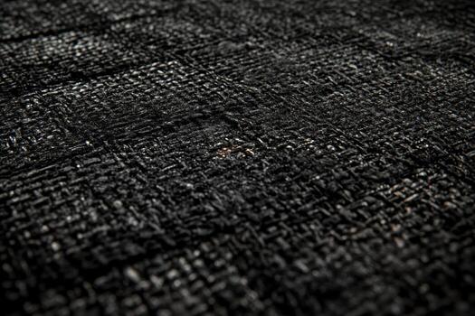 Patterned black textile surface with intricate texture photo