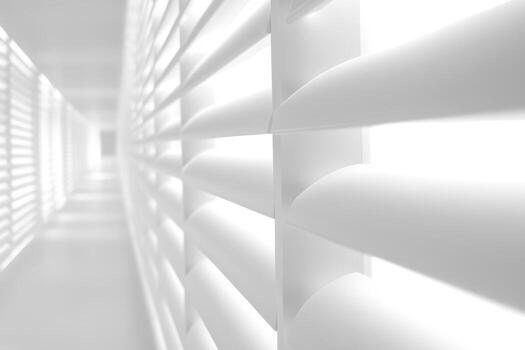 Light filters through modern window blinds in a minimal space photo