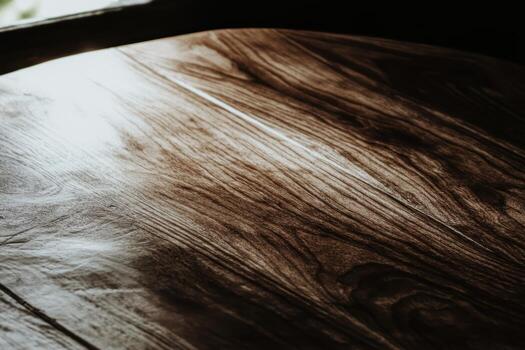 Natural wood grain on a table surface in soft light photo
