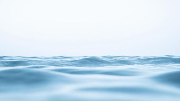 Calm blue ocean surface under soft light photo