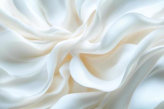 Soft white fabric drapes elegantly in flowing waves photo