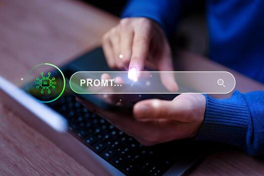 Searching for information using a smartphone while working on a laptop in a modern workspace photo