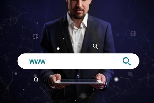 Business professional using a digital tablet to search online in a dark, futuristic environment photo