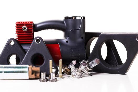 Various mechanical components arranged for inspection in a workshop setting photo