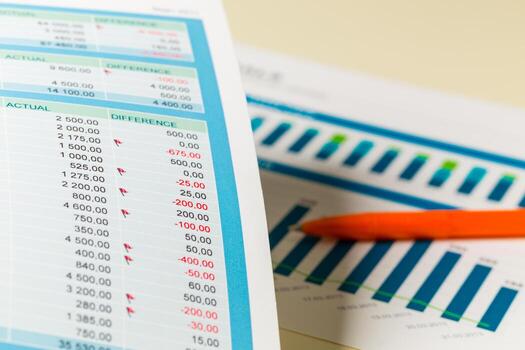 Financial report showing data analysis with graphs and numerical figures on a desk photo