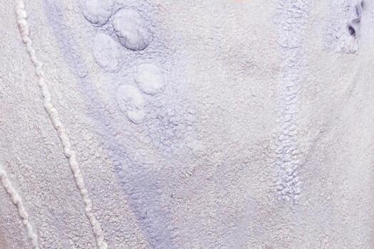 Textured surface showcasing intricate patterns and random shapes in soft fabric material photo