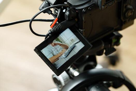 Camera setup for recording tutorials at a modern workspace during bright daylight photo