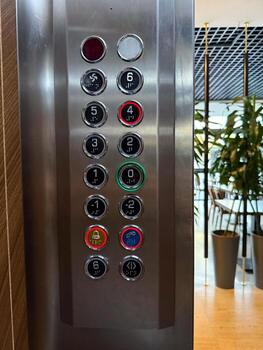 Elevator panel with numbered floor buttons. Technology, navigation, and public service reflecting accessibility, urban architecture, and modern functional design. photo