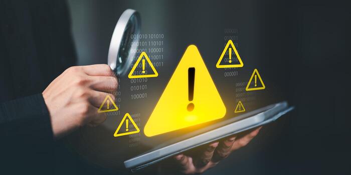 Cybersecurity warning concept with glowing yellow alert icons, binary code, and digital risk symbols representing online safety, data protection, and system threat prevention. photo