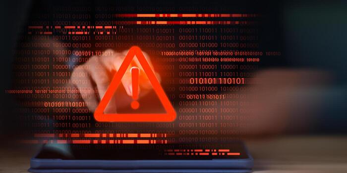 Red warning exclamation icon over binary code background, symbolizing cyber attack alert, system error, malware threat, hacking breach, data protection, online security risk, firewall defense photo