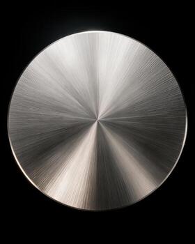 Shiny circular metal surface with brushed texture and light photo