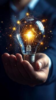 Illuminated Lightbulb with Interconnected Network in Hands photo