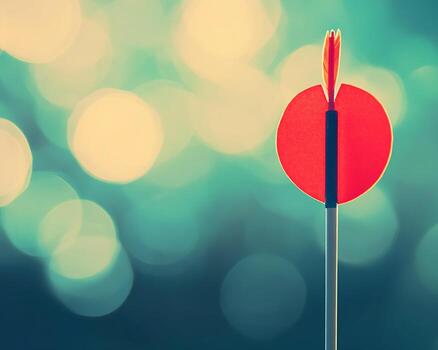 Red Dart with Fletching Against Bokeh Background photo