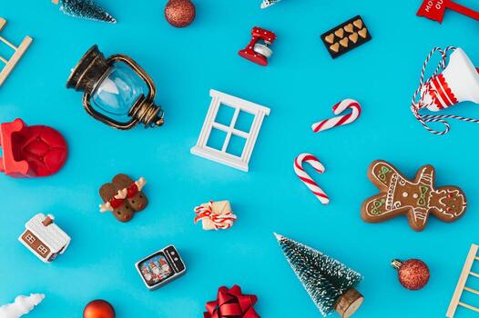 Christmas pattern made of various Xmas objects on light blue background. Minimal Christmas and New Year concept. Creative festive holiday pattern backdrop. Flat lay style. Top view. Xmas aesthetic. photo