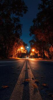 A road at night with a full moon in the background photo