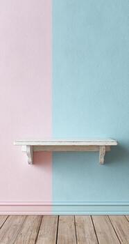 Empty shelf against a pink and blue wall photo