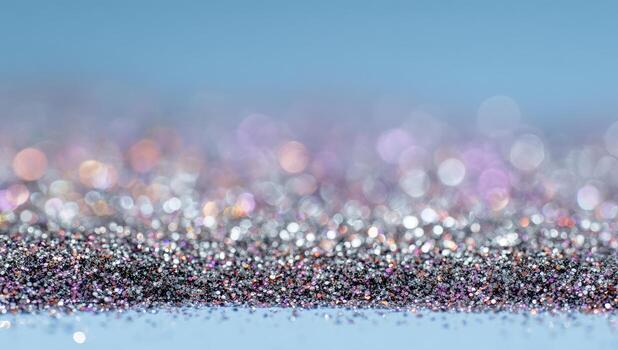 A close up of glitter on a blue background photo