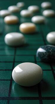 A close up of a board with many white stones photo