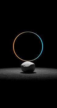 A rock with a circle around it in the dark photo