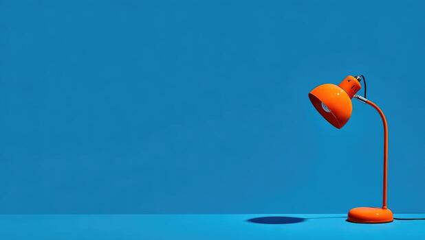 A lamp on a blue table with a blue background photo