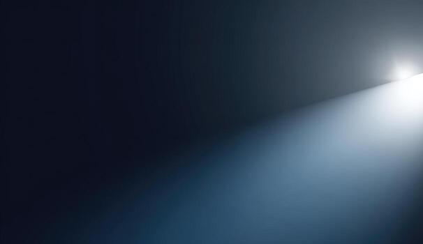 A spotlight is shining on a dark background photo