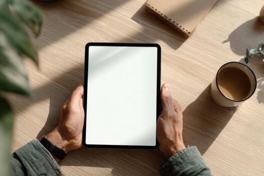 Tablet mockup on wooden table photo