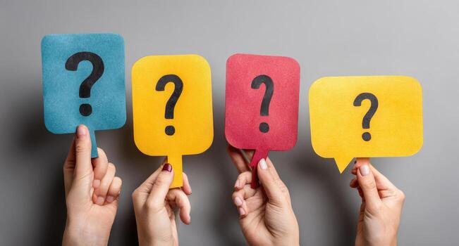 Hands holding question marks on paper photo