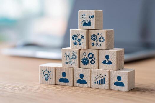A stack of wooden cubes with icons on them photo