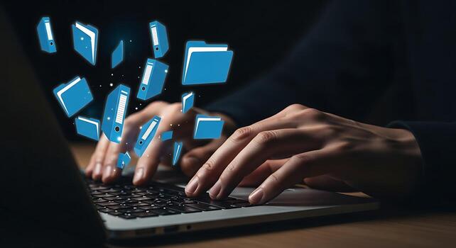 Data Transfer and Cloud Computing Concept Hands Typing on Laptop with Floating Folders photo