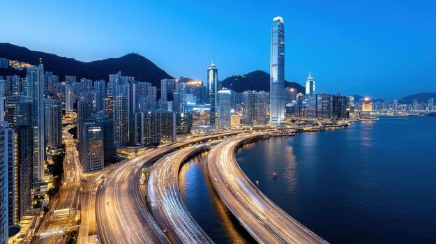 Hong kong skyline at night with traffic on the highway photo