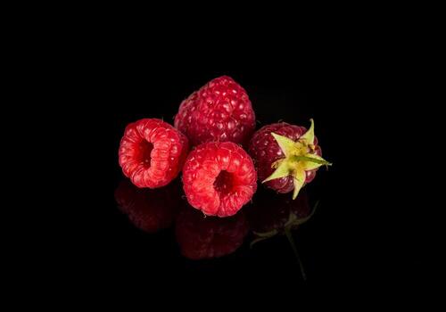 Raspberry isolated. Raspberries with leaf isolate. Raspberry with leaf isolated on black background. Free advertising space photo