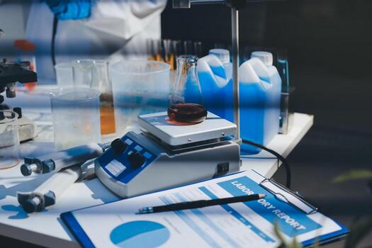 A scientist is working in a laboratory with a microscope photo