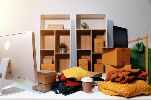 A desk with a computer, laptop, and other items photo