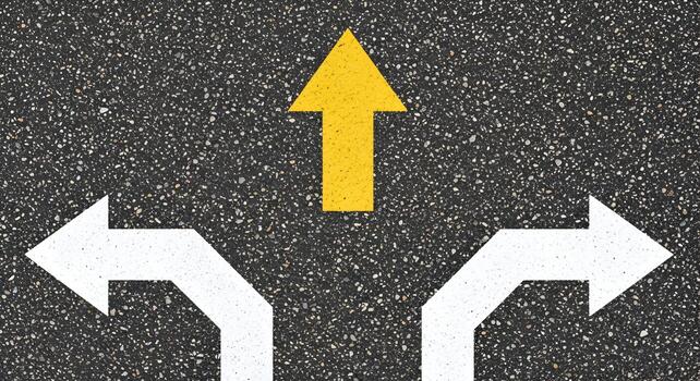 Yellow upward arrow on asphalt road signifying direction, progress, and forward movement amidst two white arrows pointing to the left and right, symbolizing choices and decisions photo