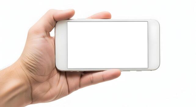 Hand holding a smartphone with a blank white screen against a white background The device is positioned horizontally, showcasing its clean design and empty display, perfect for app demonstrations or w photo
