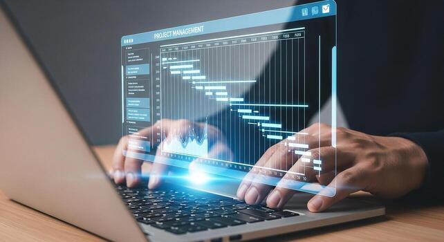 Person using a laptop computer to manage a project with Gantt chart in a modern office showing efficiency and success photo