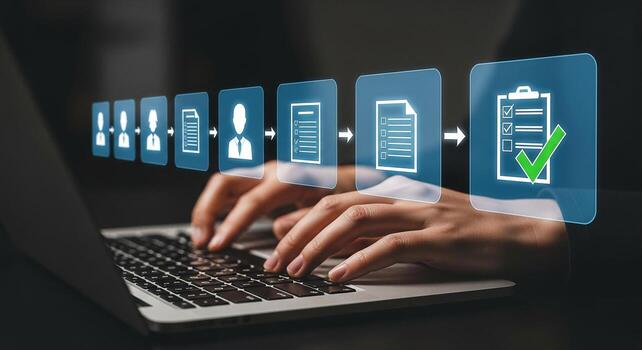 Person working on laptop computer managing a digital workflow of tasks and documents completing a checklist achieving success in a modern office photo