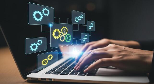 Person working on laptop computer with digital gears interface showcasing technology innovation and process optimization in a dark setting This image represents efficiency problem-solving and digital photo