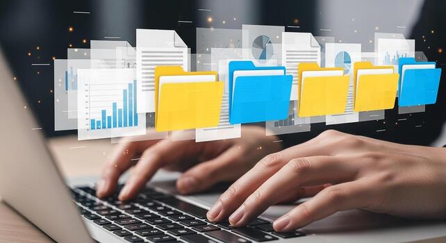 Person managing digital files and data on laptop working with colorful folders and charts concept of efficient data organization and digital workspace photo